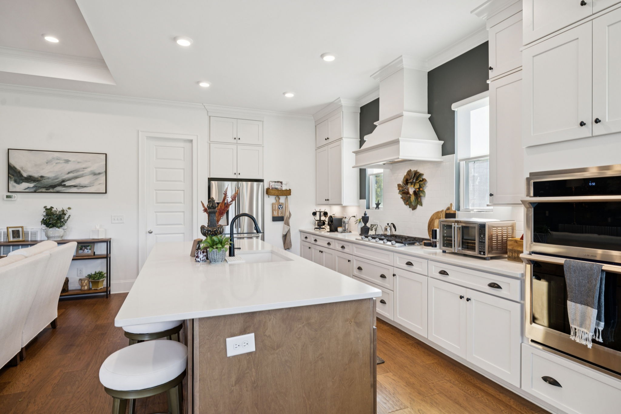 7143 Neills Branch Drive College Grove, TN 37046 - Photo 32 of 74 a kitchen with a sink a stove and white cabinets