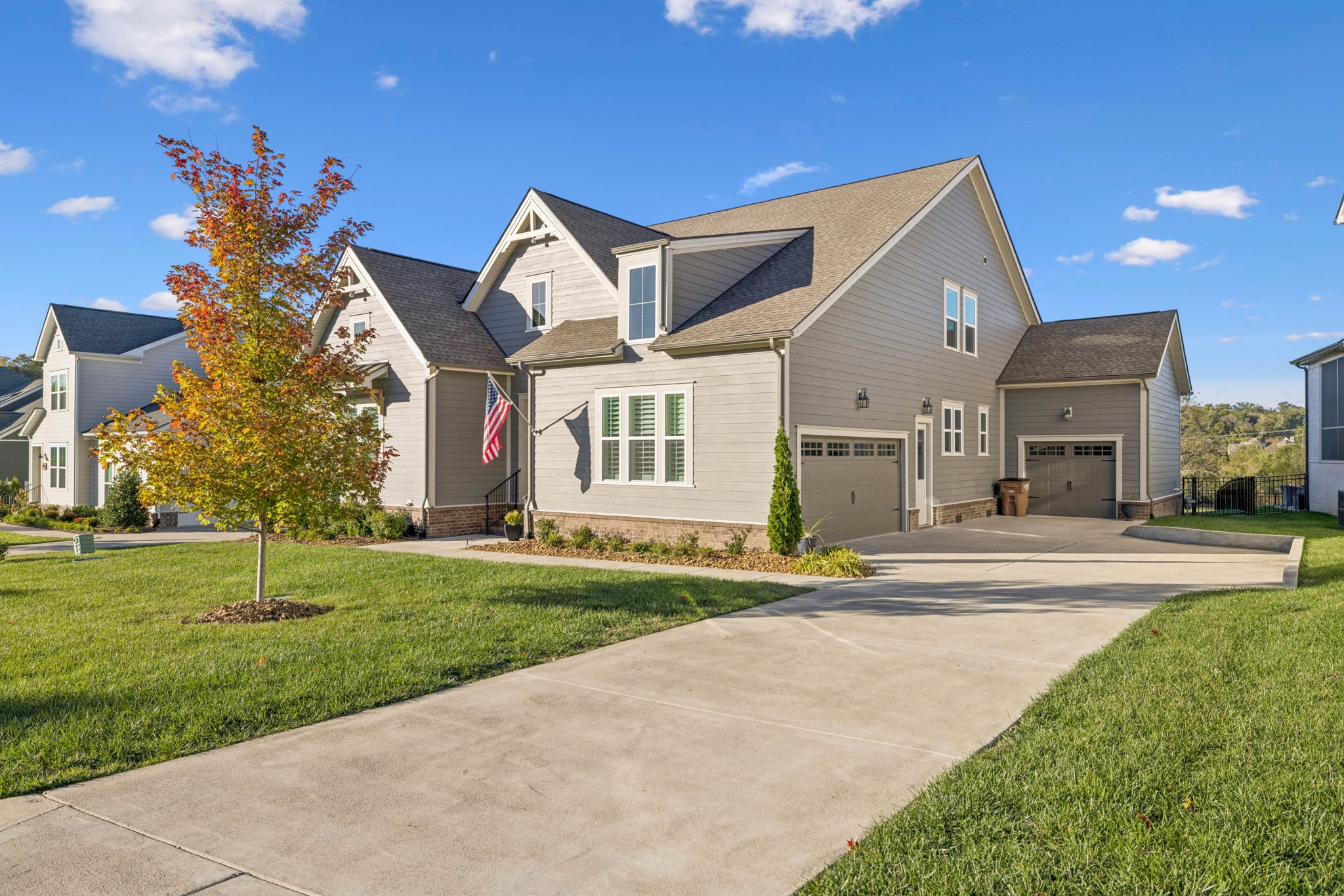 7143 Neills Branch Drive College Grove, TN 37046 - Photo 4 of 74 a view of a big house with a big yard and plants