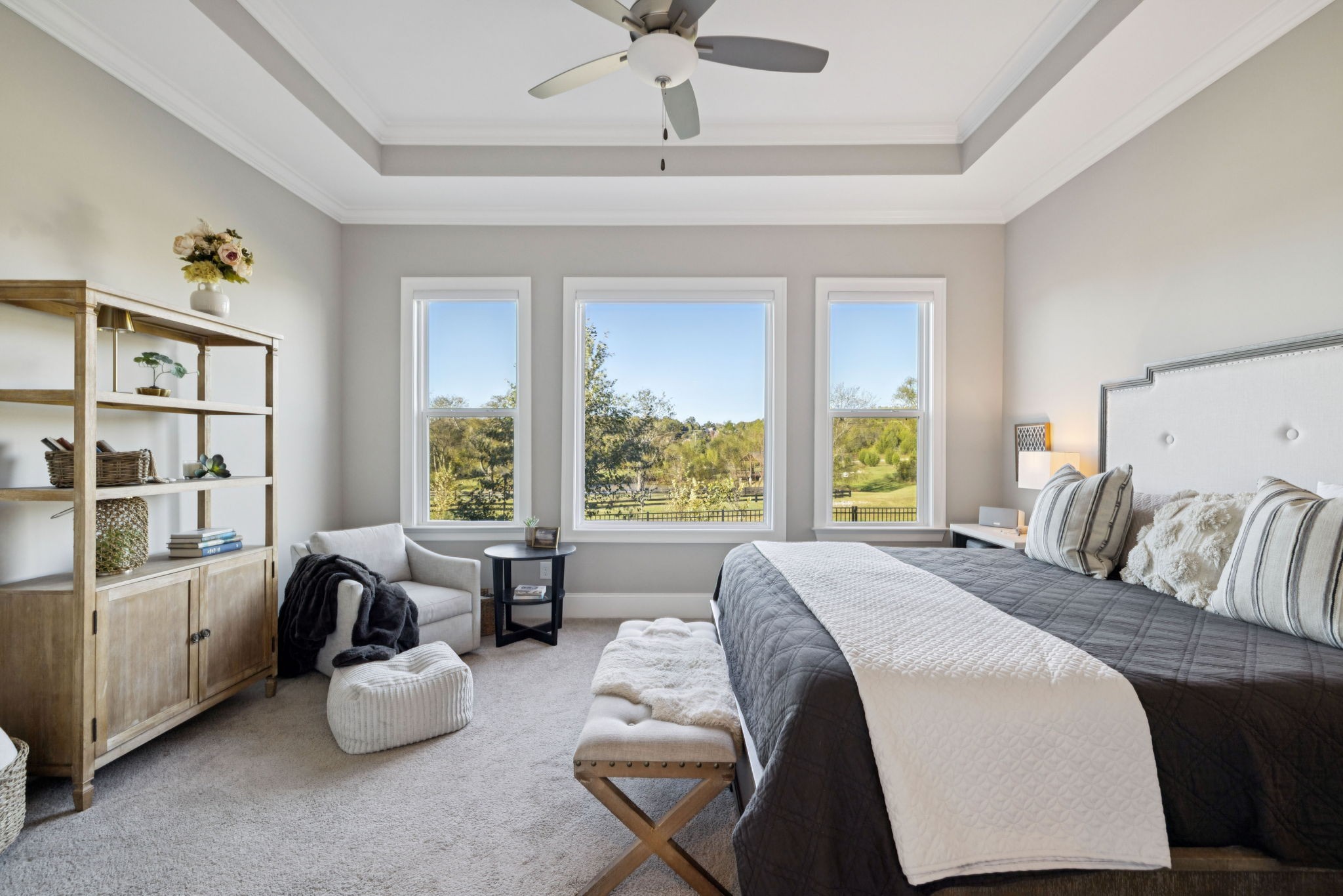 7143 Neills Branch Drive College Grove, TN 37046 - Photo 45 of 74 a spacious bedroom with a balcony a bed and a couch