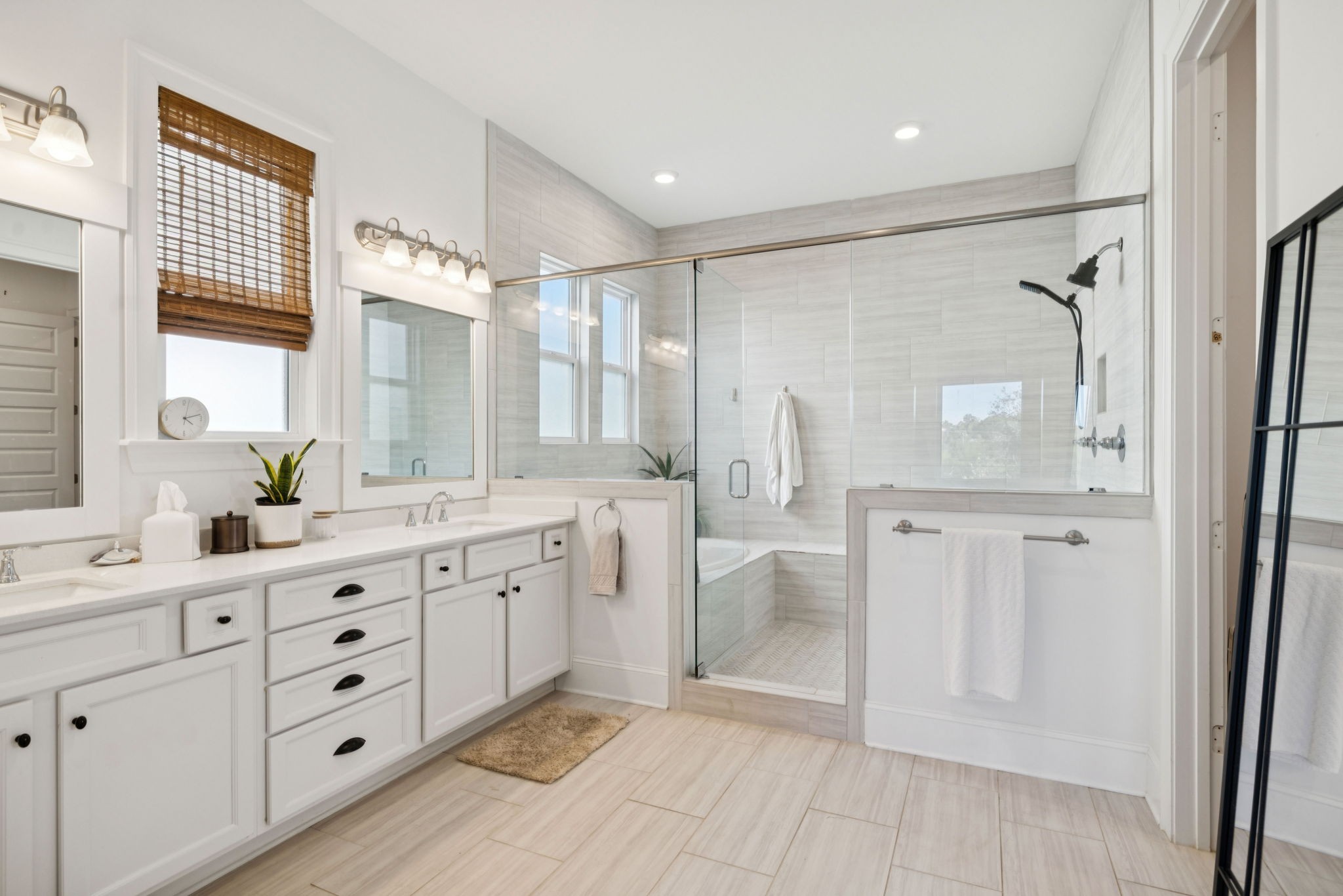 7143 Neills Branch Drive College Grove, TN 37046 - Photo 49 of 74 a spacious bathroom with a shower a sink and a mirror