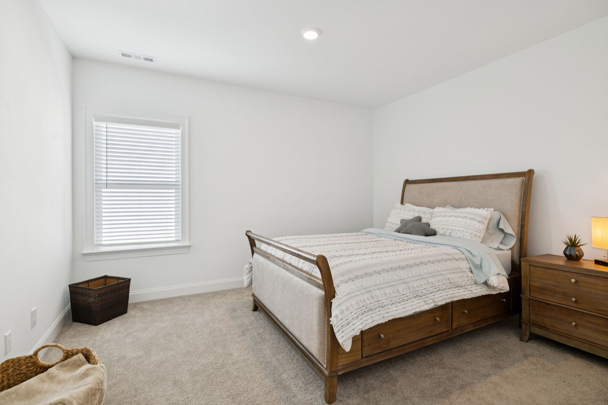 7143 Neills Branch Drive College Grove, TN 37046 - Photo 63 of 74 a bed sitting in a bedroom next to a window