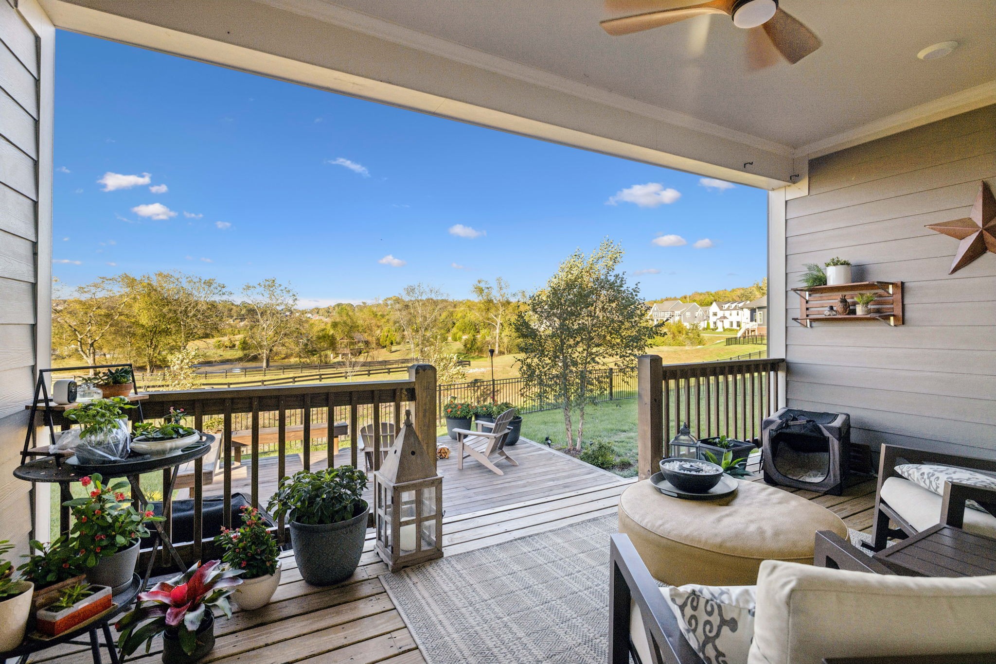 7143 Neills Branch Drive College Grove, TN 37046 - Photo 67 of 74 a living room with furniture floor to ceiling window and a table