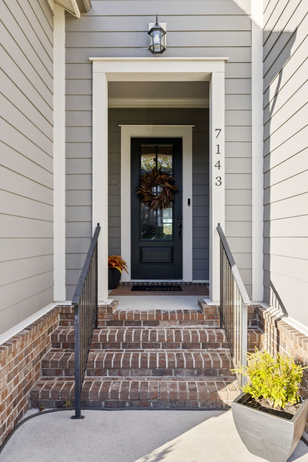 7143 Neills Branch Drive College Grove, TN 37046 - Photo 7 of 74 a front view of a house with potted plants