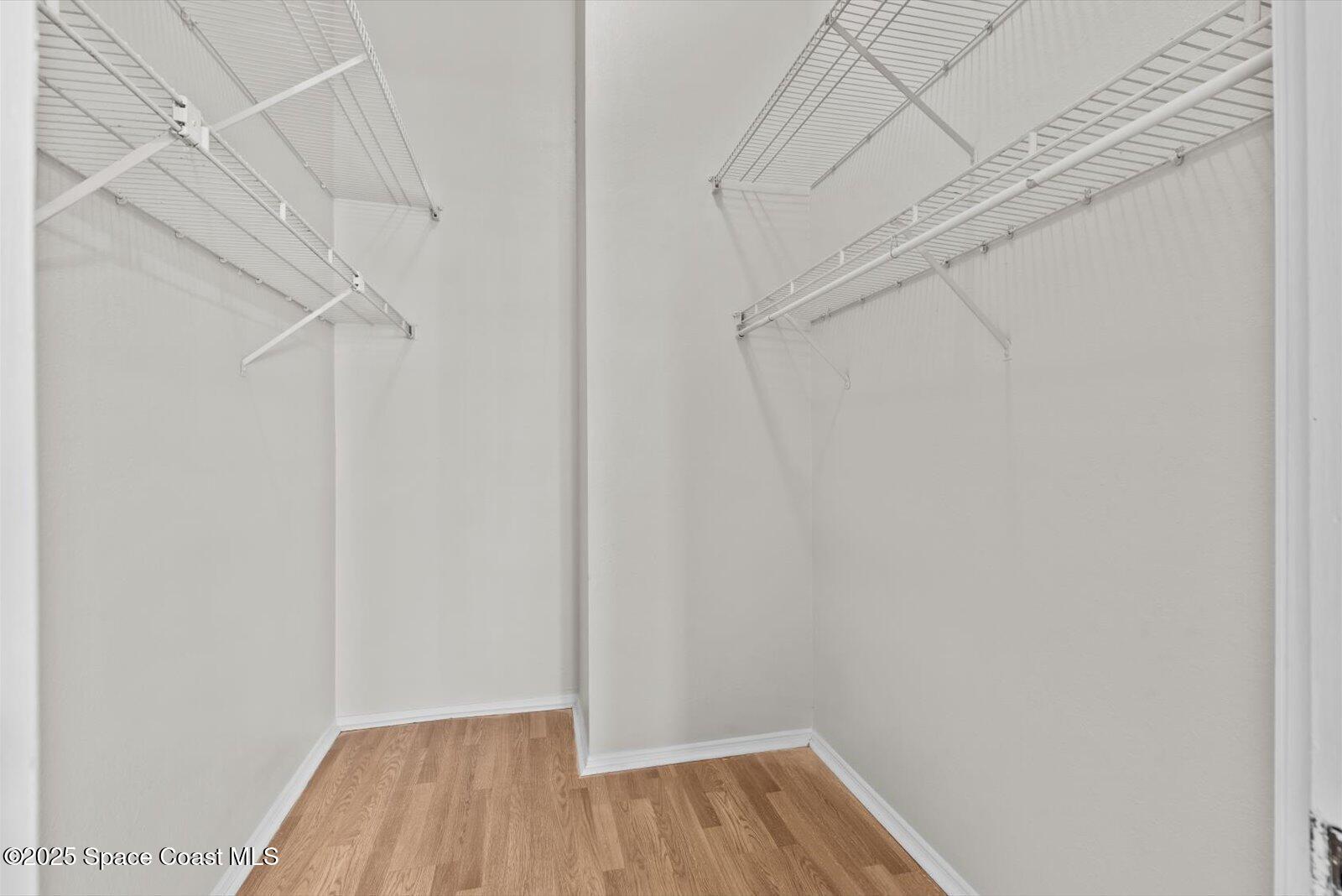 1037 Southwest California Boulevard Port St. Lucie, FL 34953 - Photo 21 of 38 a view of a room with wooden floor