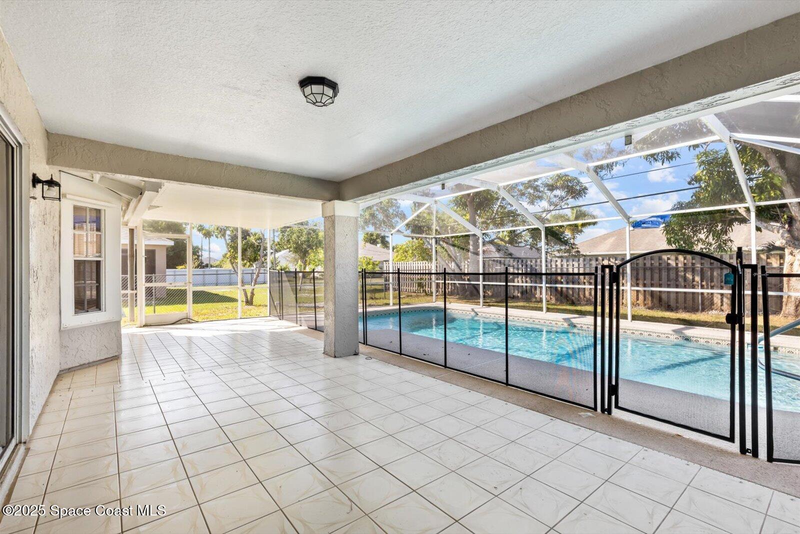 1037 Southwest California Boulevard Port St. Lucie, FL 34953 - Photo 27 of 38 a view of a swimming pool