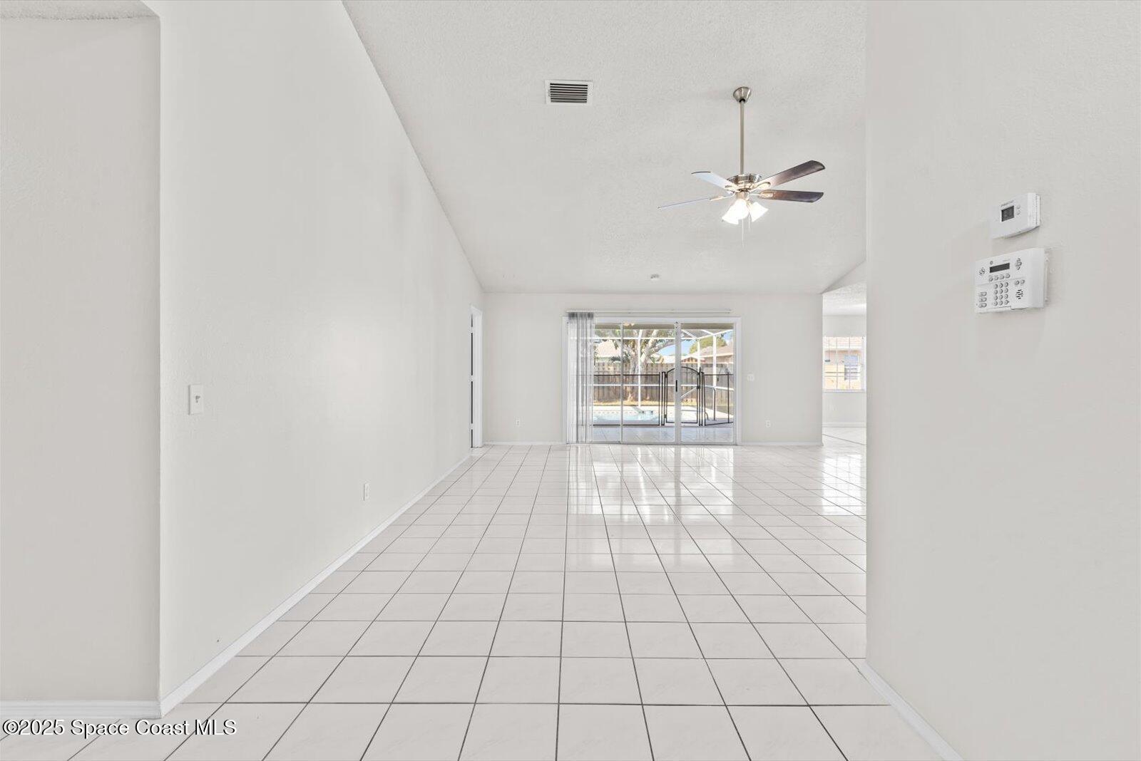 1037 Southwest California Boulevard Port St. Lucie, FL 34953 - Photo 4 of 38 a view of an empty room with a window
