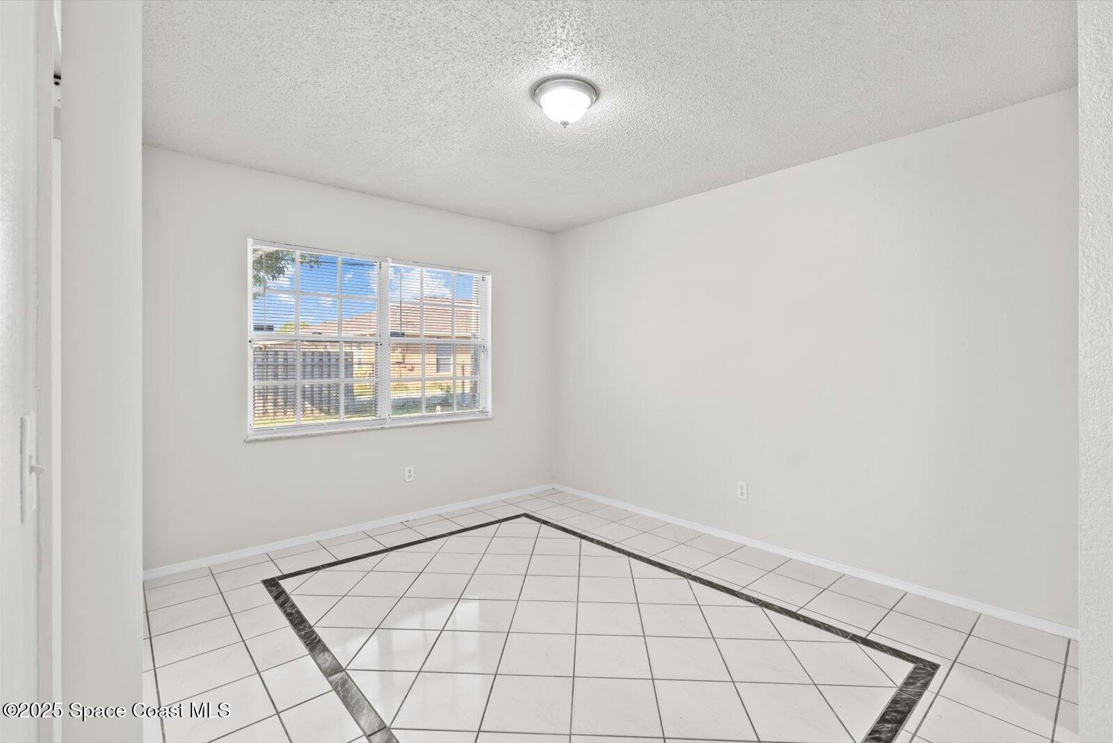 1037 Southwest California Boulevard Port St. Lucie, FL 34953 - Photo 8 of 38 a view of an empty room