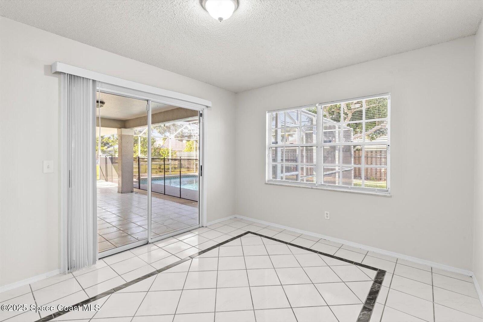 1037 Southwest California Boulevard Port St. Lucie, FL 34953 - Photo 9 of 38 a view of an empty room and window