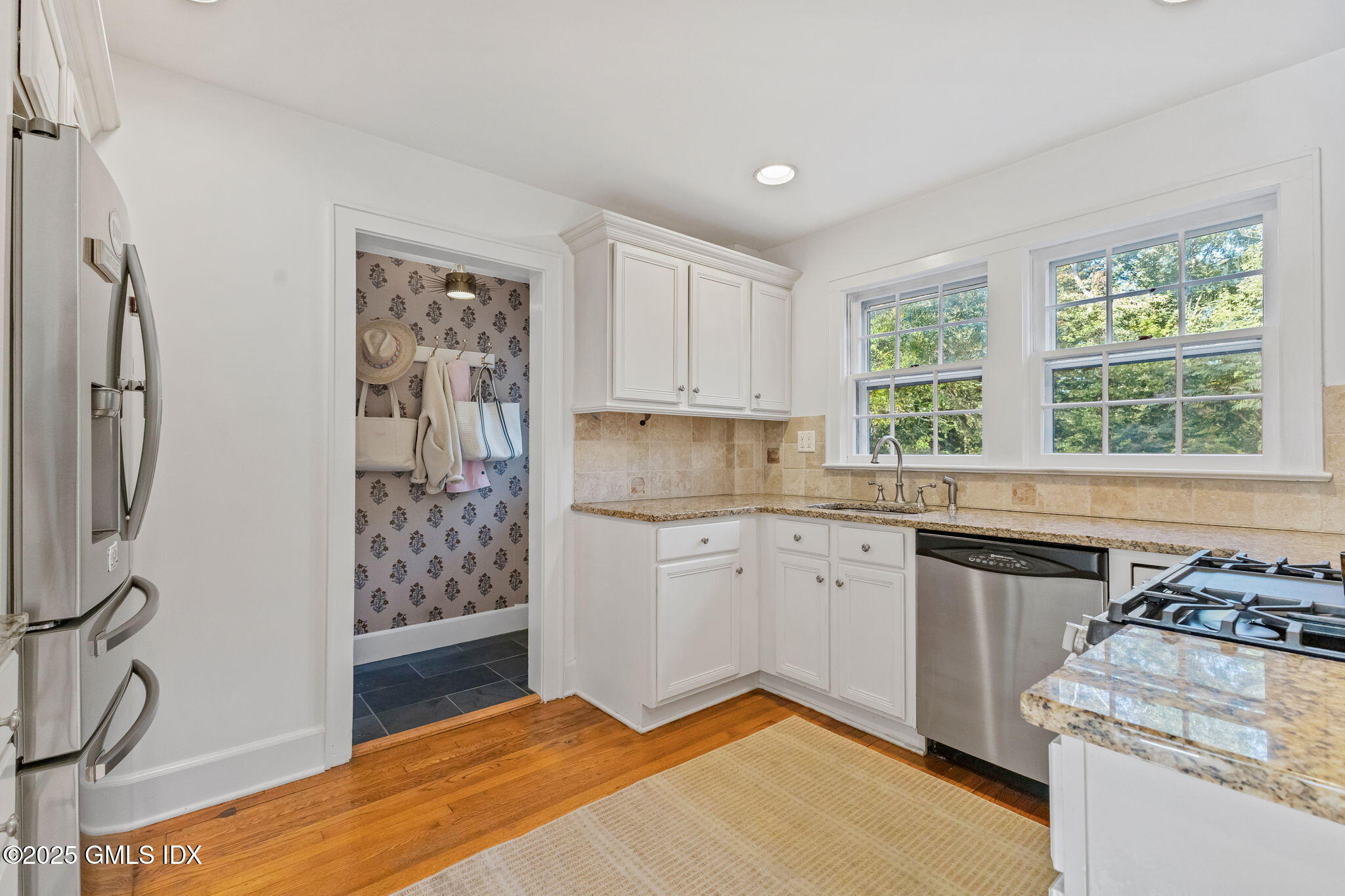 27 Briar Brae Road Stamford, CT 06903 - Photo 11 of 28 a kitchen with a stove a sink and a refrigerator