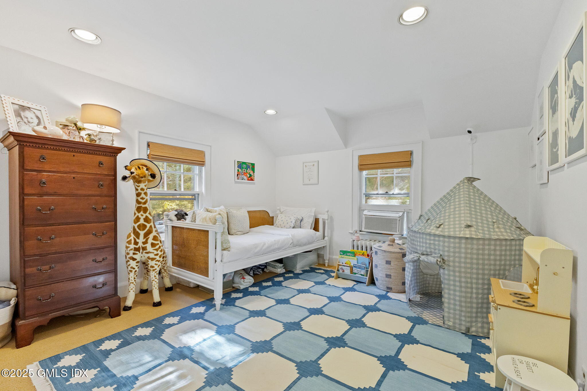 27 Briar Brae Road Stamford, CT 06903 - Photo 19 of 28 a living room with furniture and a baby crib