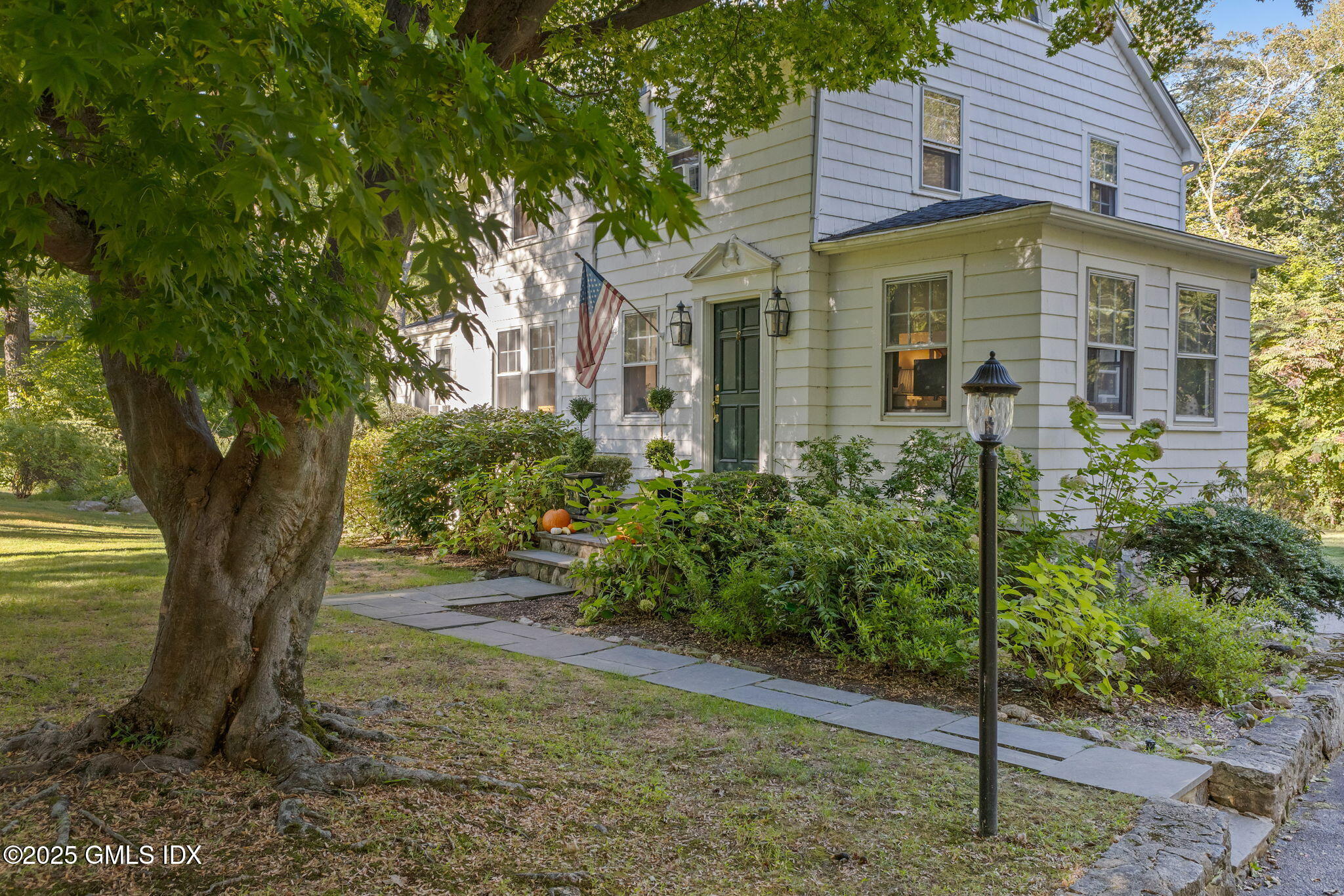 27 Briar Brae Road Stamford, CT 06903 - Photo 24 of 28 a front view of a house with a yard