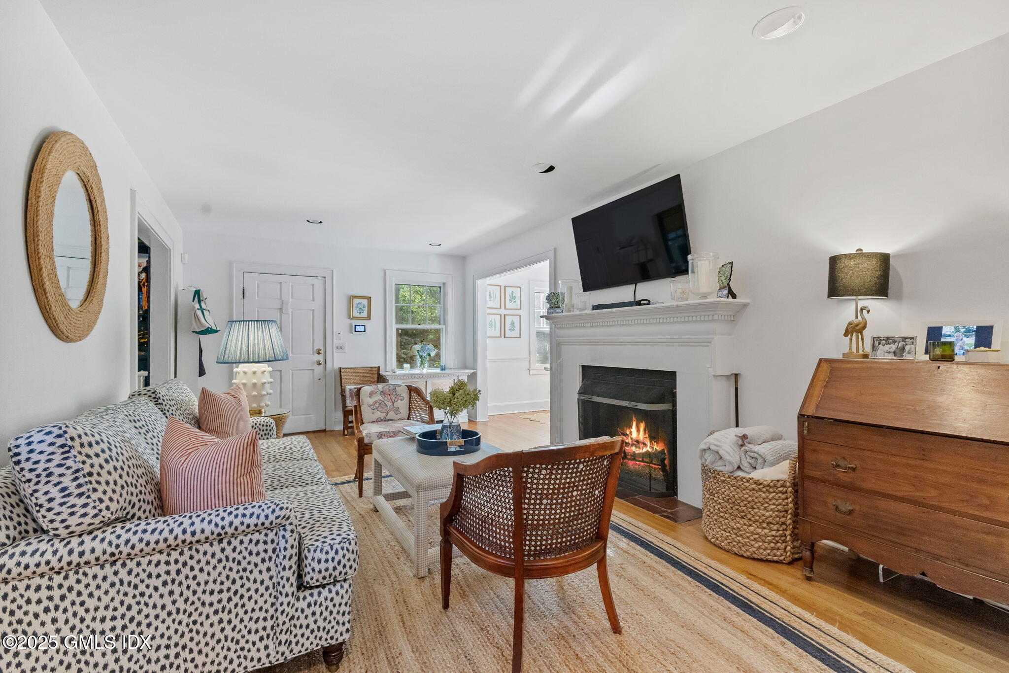 27 Briar Brae Road Stamford, CT 06903 - Photo 4 of 28 a living room with furniture a flat screen tv and a fireplace
