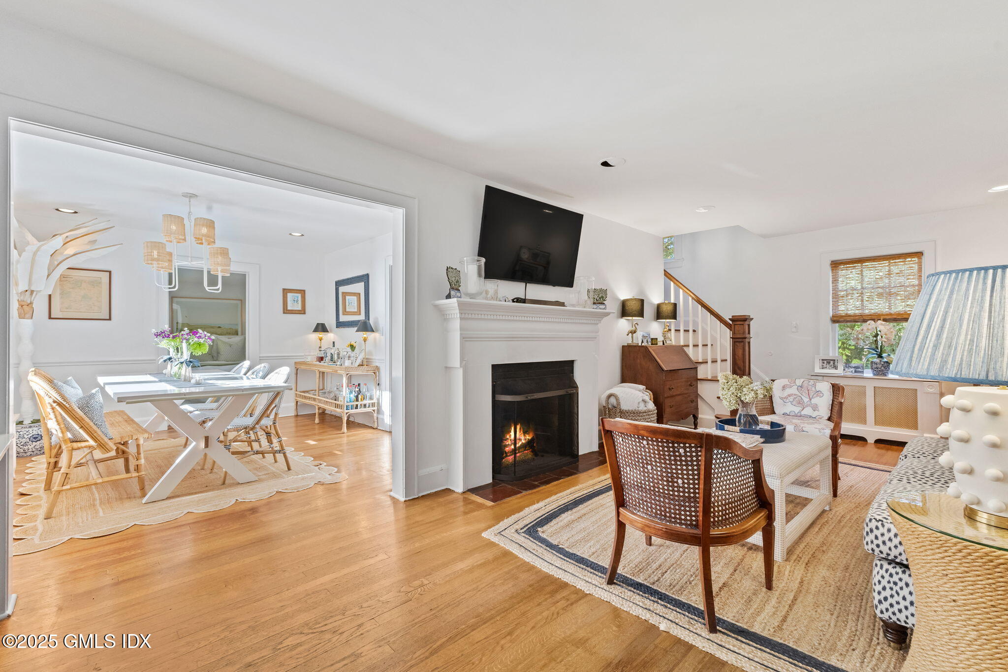 27 Briar Brae Road Stamford, CT 06903 - Photo 5 of 28 a living room with furniture a fireplace and a flat screen tv