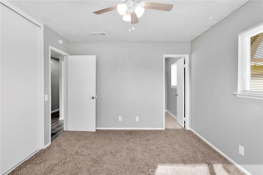 15846 Inyo Street Victorville, CA 92395 - Photo 18 of 44 a view of an empty room with a window