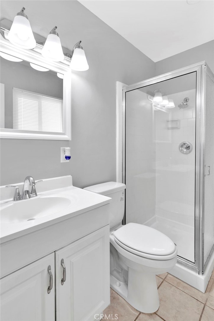 15846 Inyo Street Victorville, CA 92395 - Photo 21 of 44 a bathroom with a sink a toilet and shower