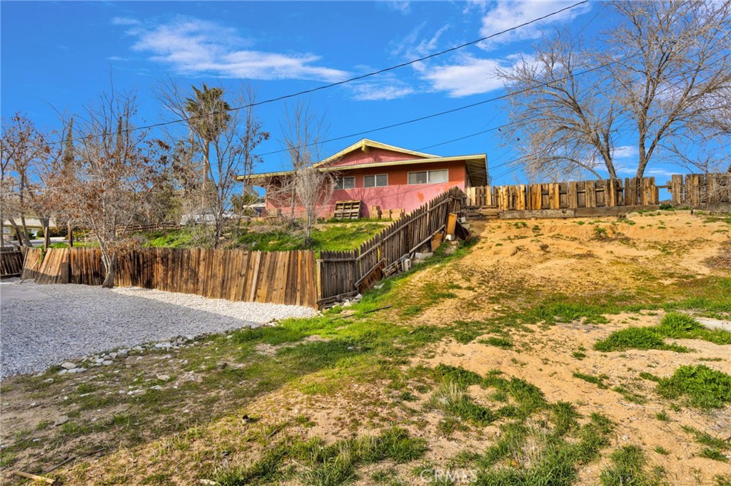 15846 Inyo Street Victorville, CA 92395 - Photo 29 of 44 a view of a yard with a house