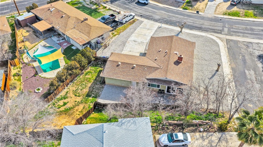 15846 Inyo Street Victorville, CA 92395 - Photo 30 of 44 an aerial view of a house with a yard and a large tree