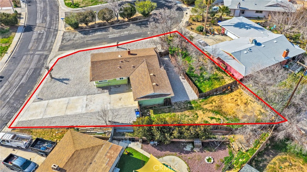 15846 Inyo Street Victorville, CA 92395 - Photo 31 of 44 an aerial view of a house with a yard and a large tree