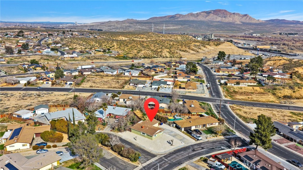 15846 Inyo Street Victorville, CA 92395 - Photo 36 of 44 an aerial view of residential houses with outdoor space