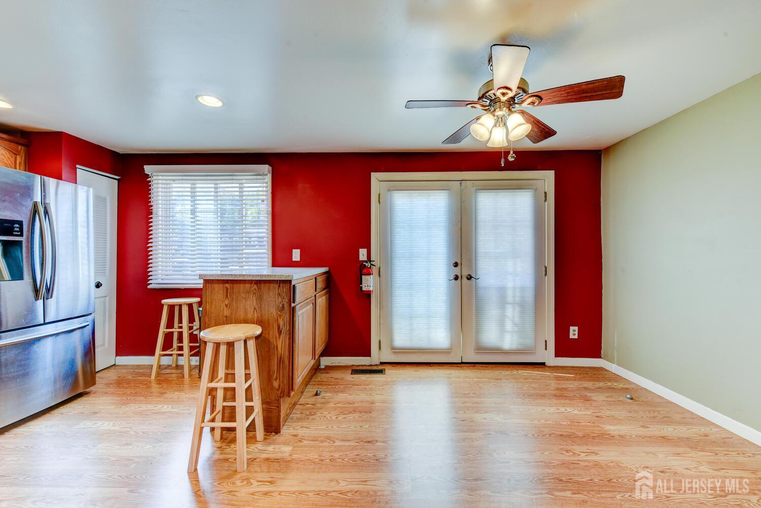 675 Bound Brook Road, Unit C0016 Dunellen, NJ 08812 - Photo 14 of 39 a view of a livingroom with furniture ceiling fan and window