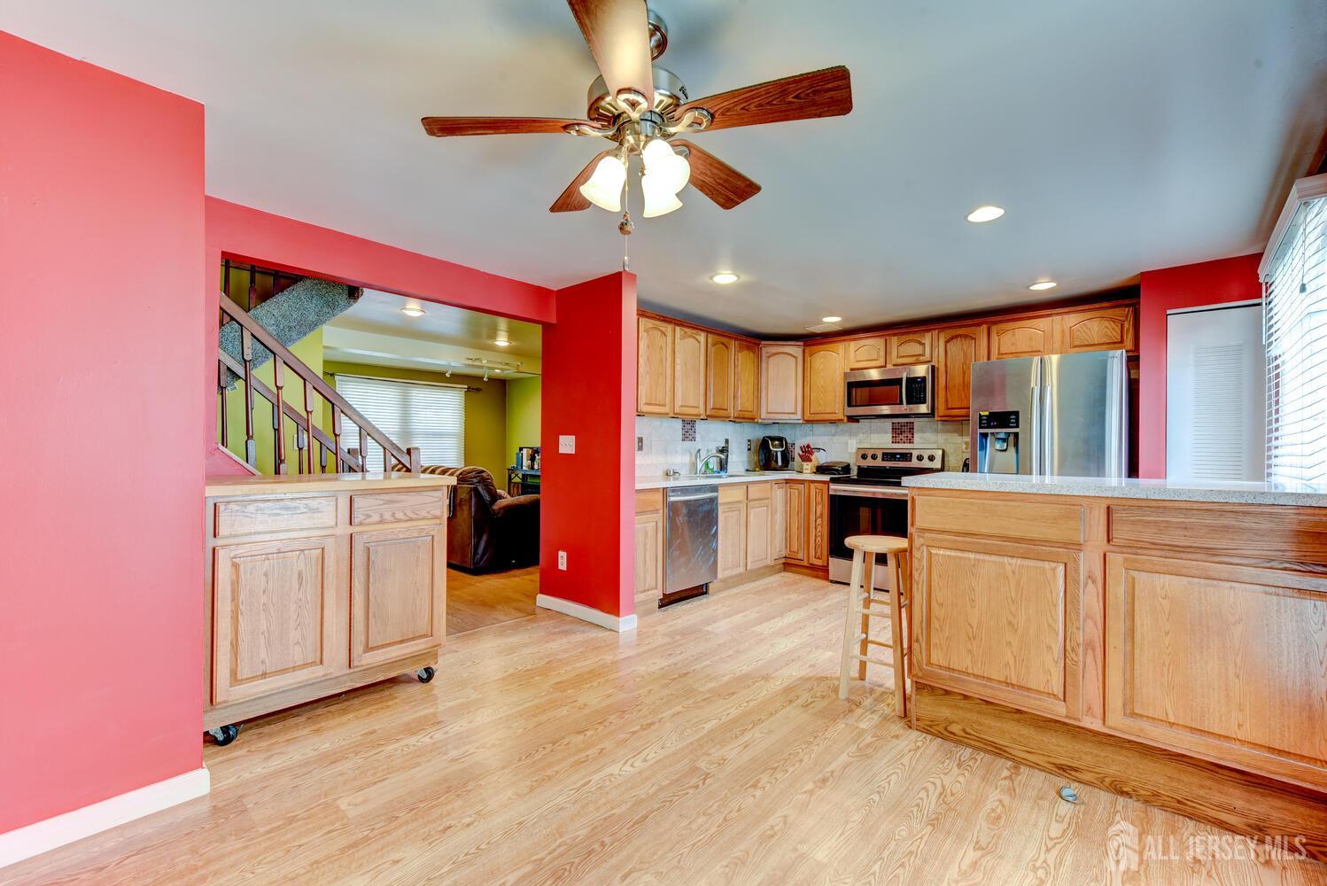 675 Bound Brook Road, Unit C0016 Dunellen, NJ 08812 - Photo 16 of 39 a kitchen with white cabinets and appliances