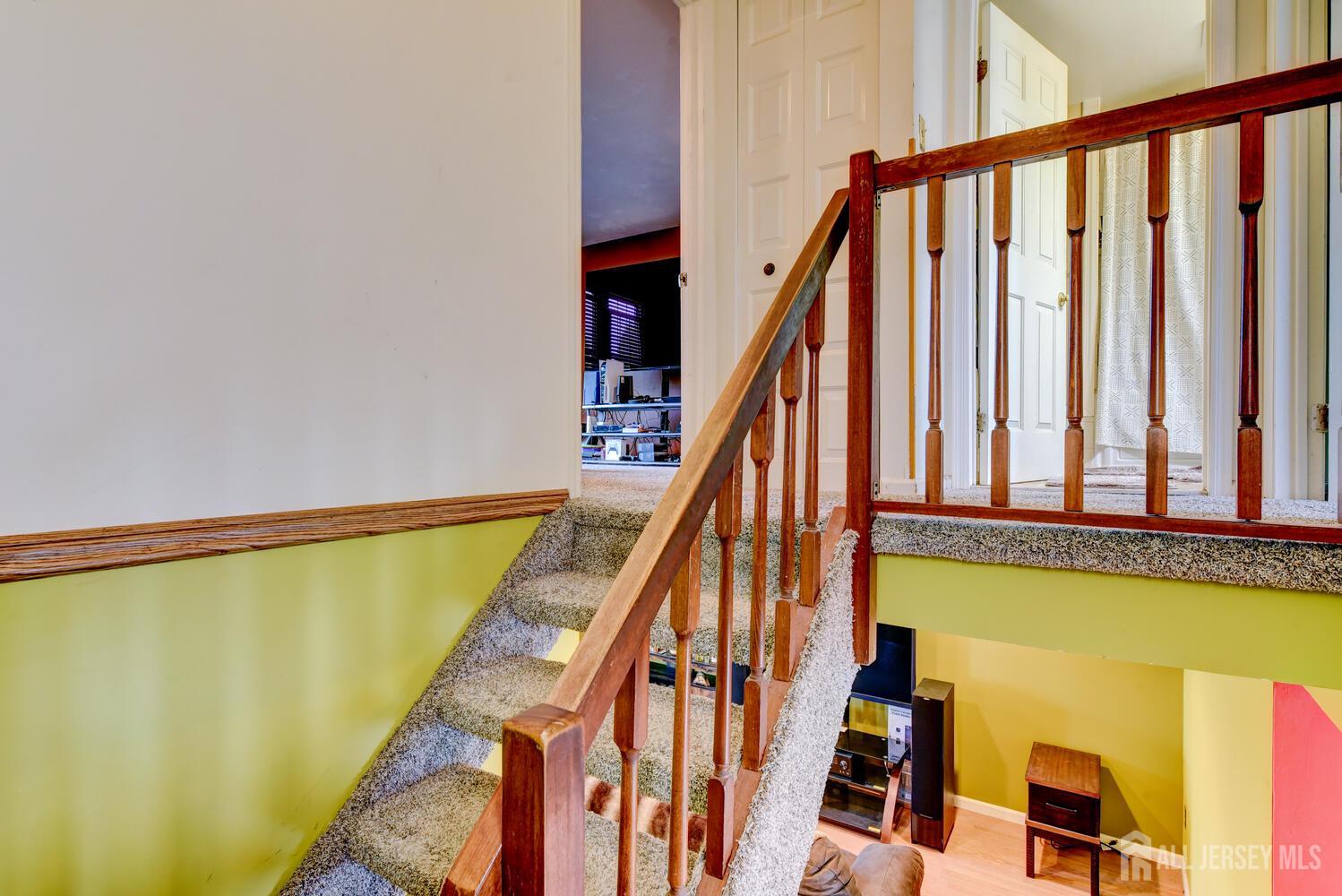 675 Bound Brook Road, Unit C0016 Dunellen, NJ 08812 - Photo 26 of 39 a view of an ocean with wooden floor and stairs