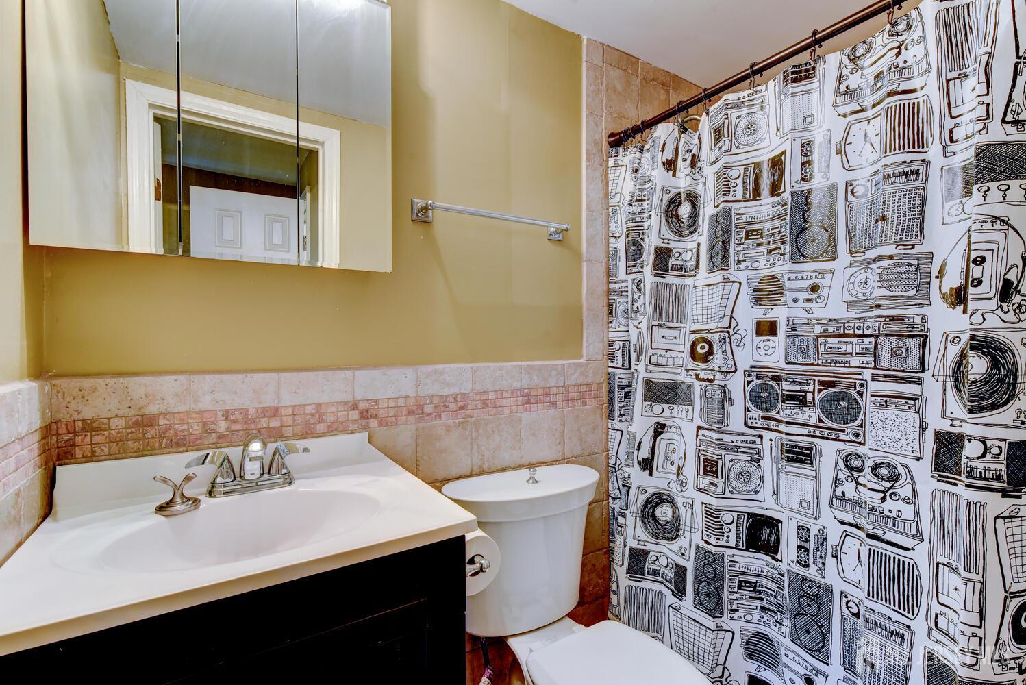 675 Bound Brook Road, Unit C0016 Dunellen, NJ 08812 - Photo 32 of 39 a bathroom with a sink and a mirror