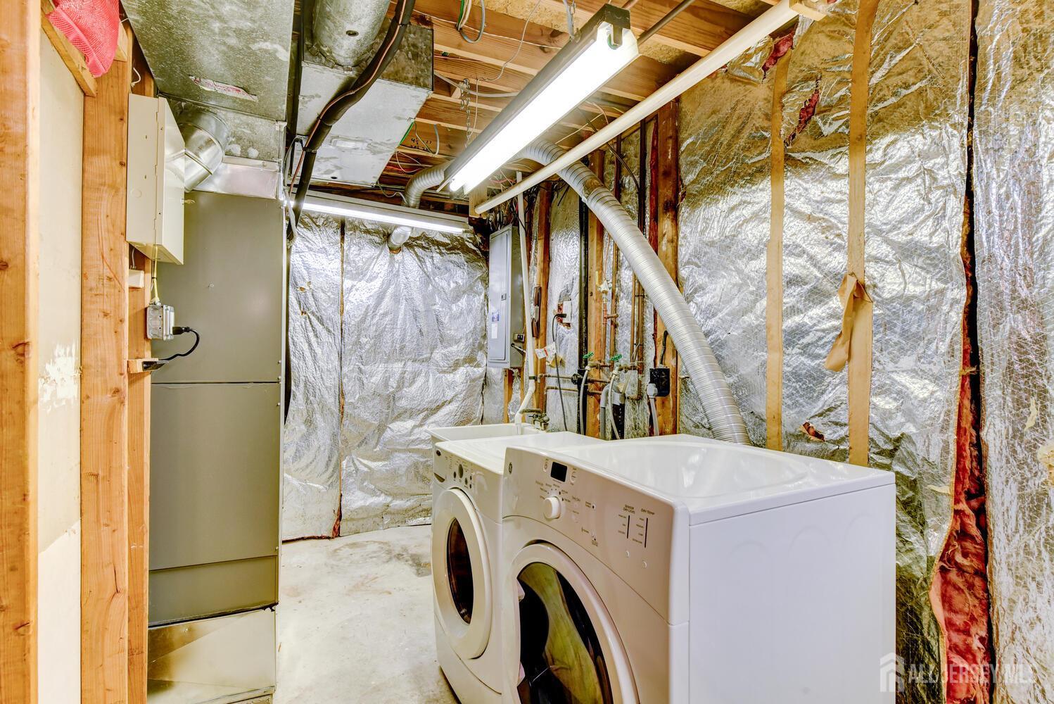 675 Bound Brook Road, Unit C0016 Dunellen, NJ 08812 - Photo 35 of 39 a utility room with dryer and washer