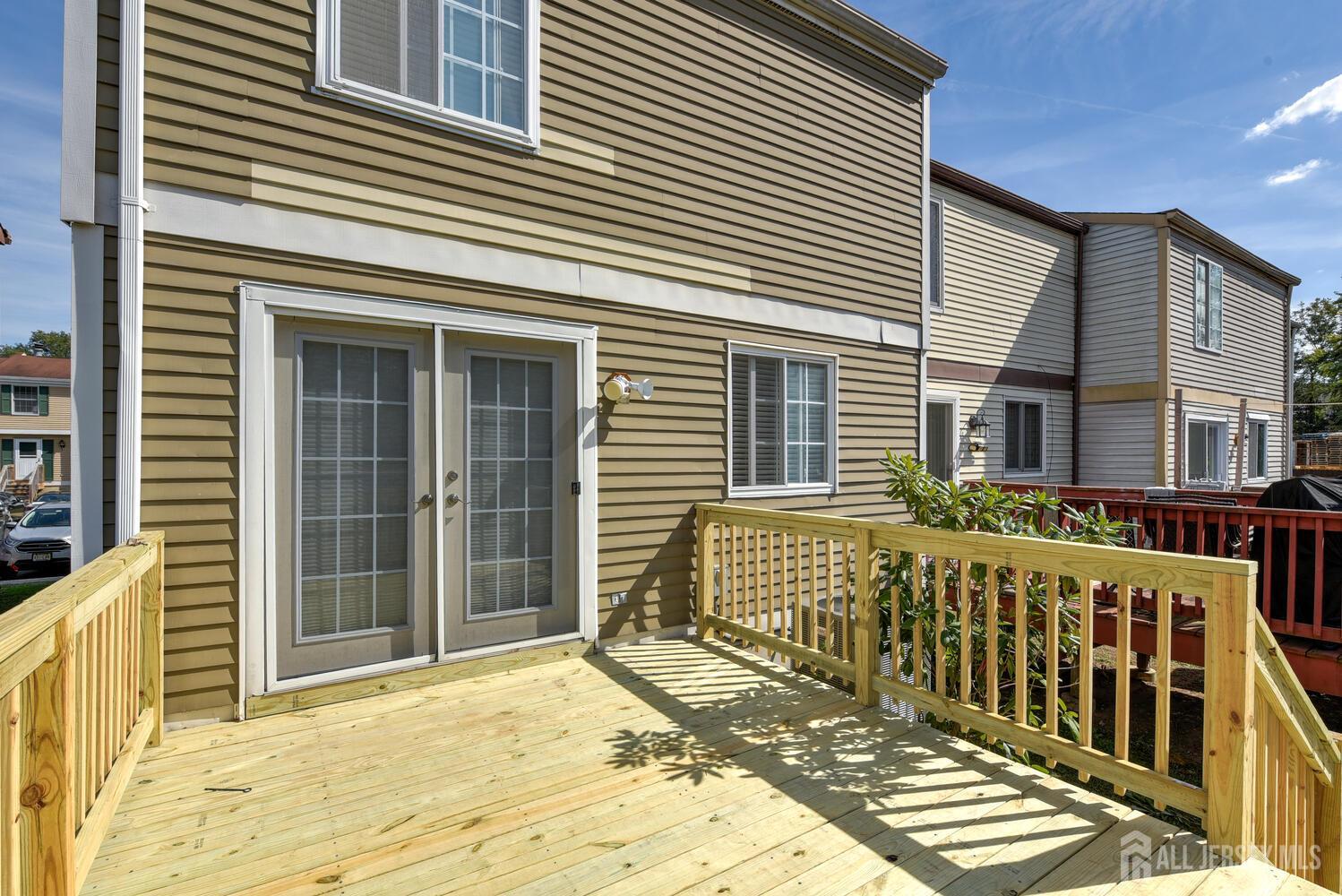 675 Bound Brook Road, Unit C0016 Dunellen, NJ 08812 - Photo 37 of 39 a view of a house with wooden fence