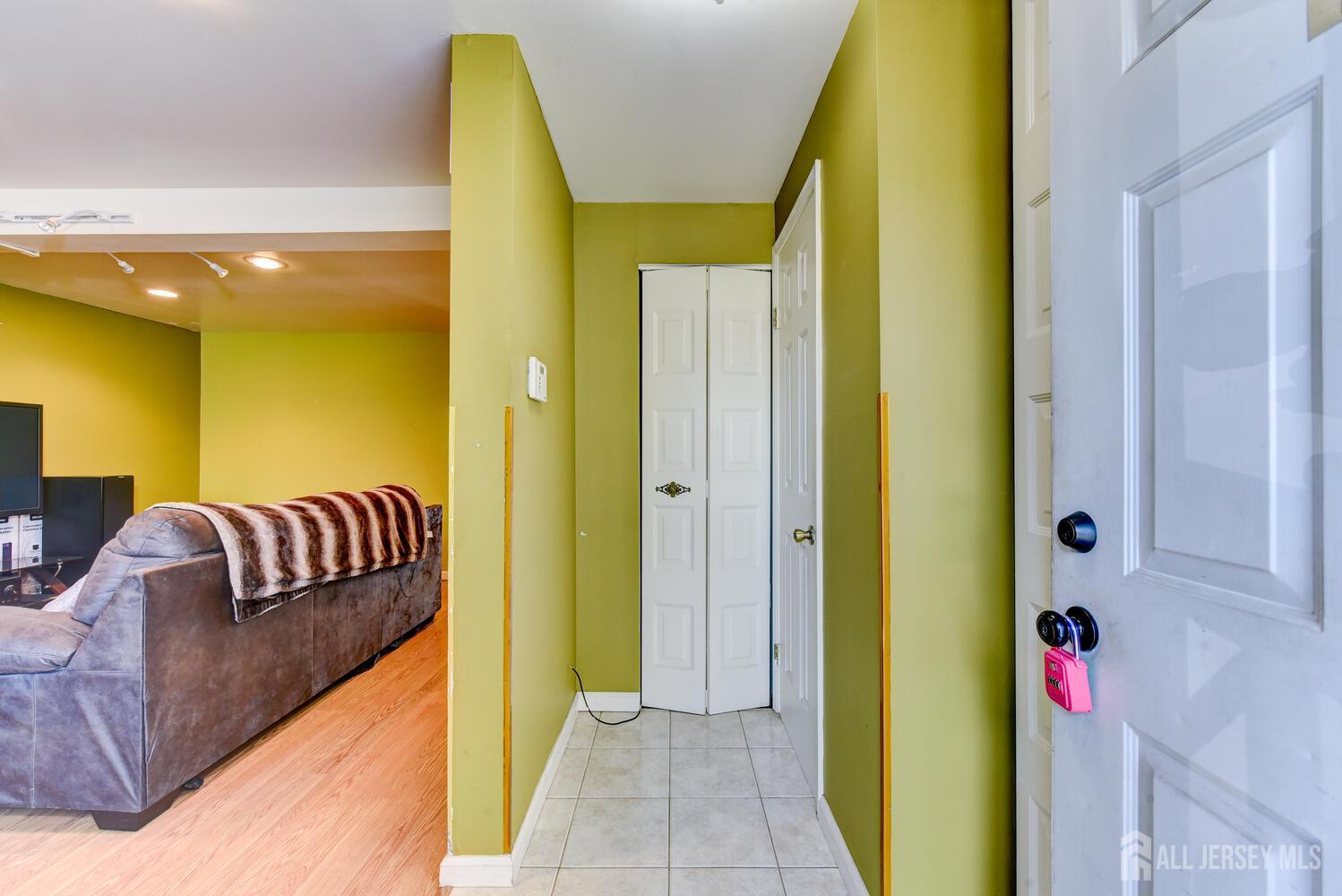 675 Bound Brook Road, Unit C0016 Dunellen, NJ 08812 - Photo 6 of 39 a entryway with a couch and a table