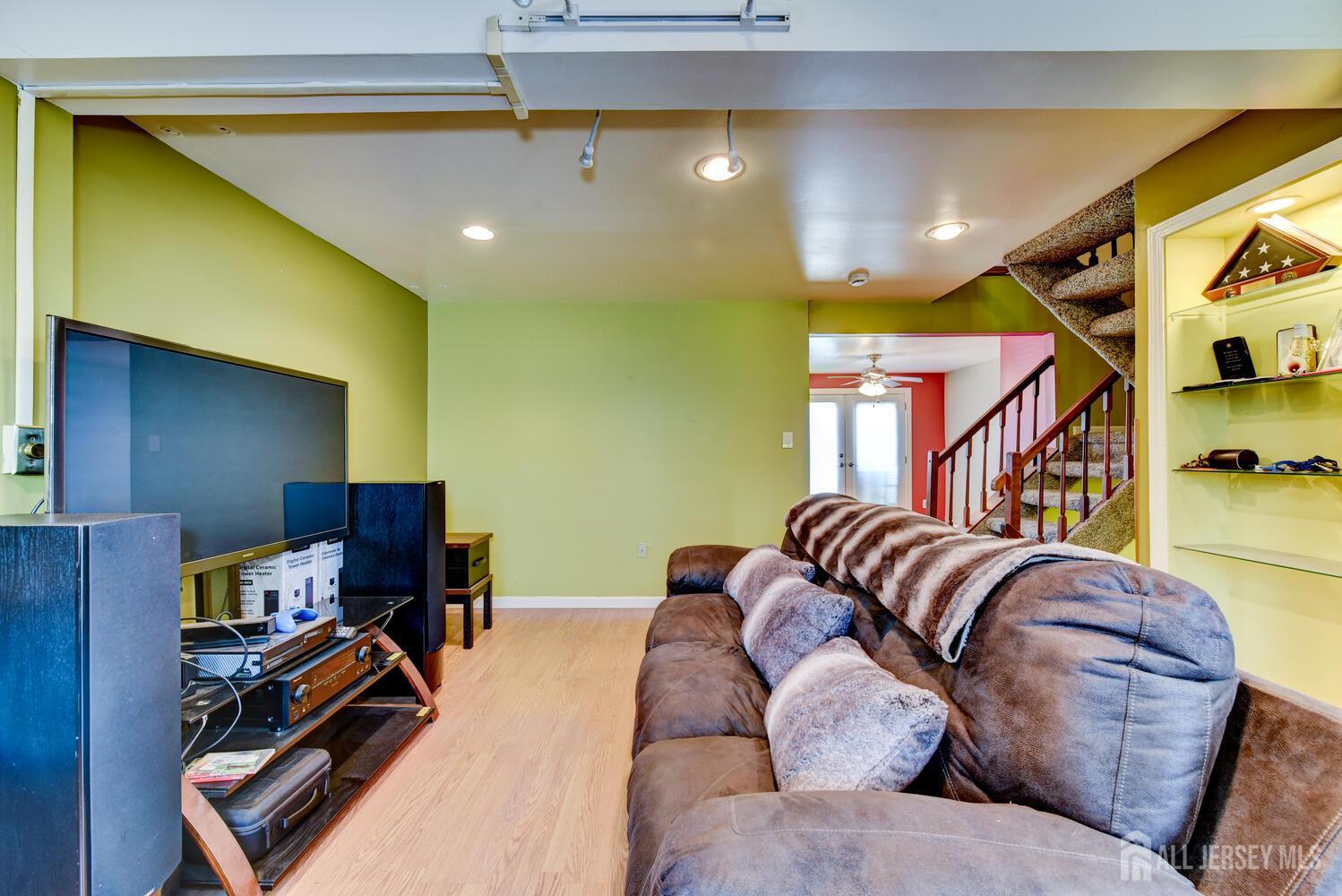 675 Bound Brook Road, Unit C0016 Dunellen, NJ 08812 - Photo 8 of 39 a living room with furniture and gym equipment