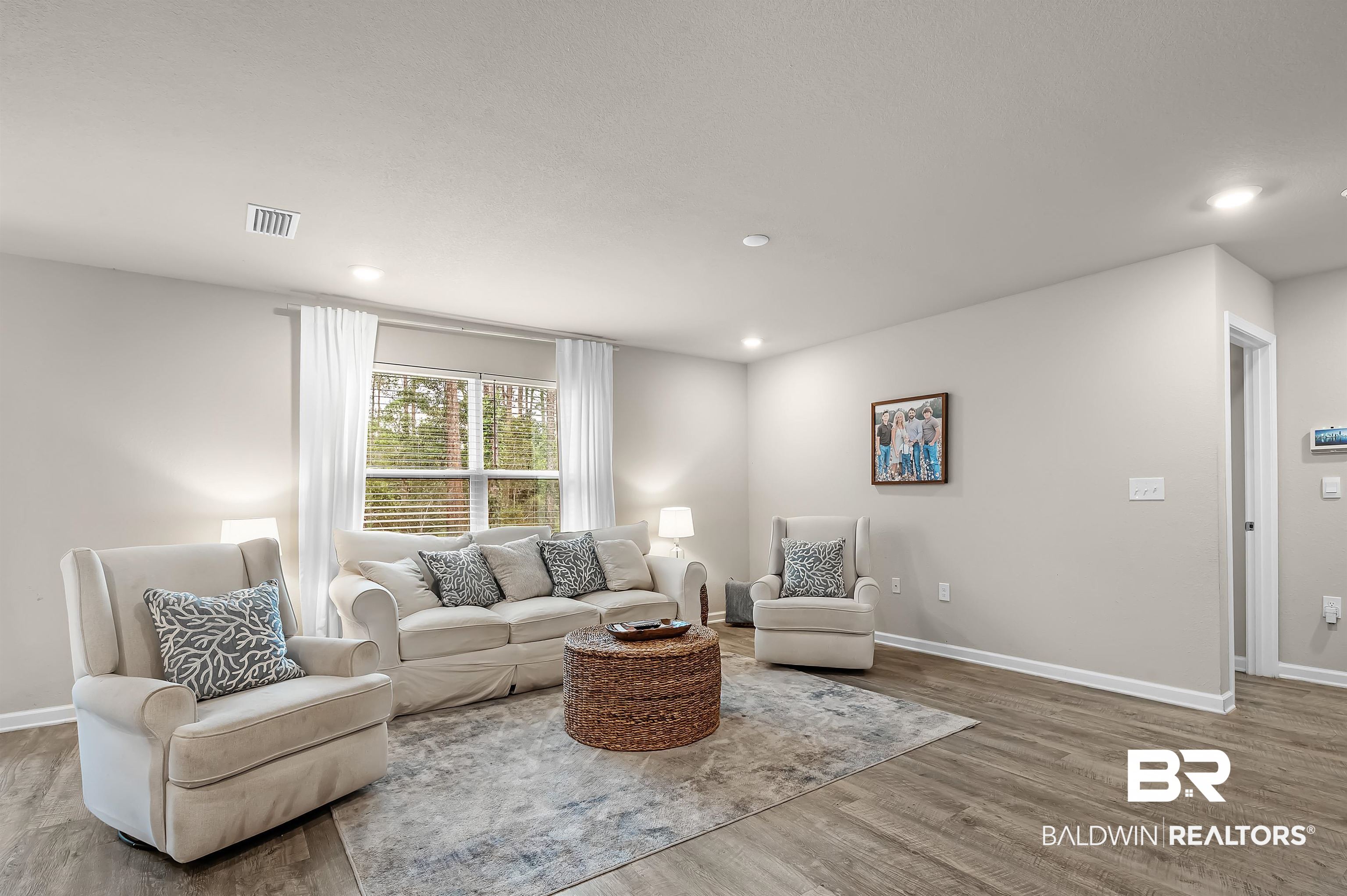 24549 Broken Sound Loop Orange Beach, AL 36561 - Photo 8 of 57 Living room featuring hardwood / wood-style flooring