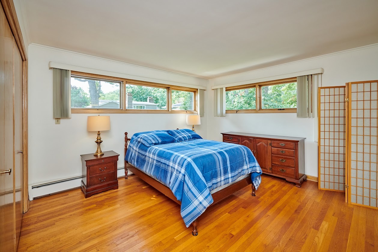 1859 Prairie Avenue Park Ridge, IL 60068 - Photo 12 of 27 a bedroom with a bed and window