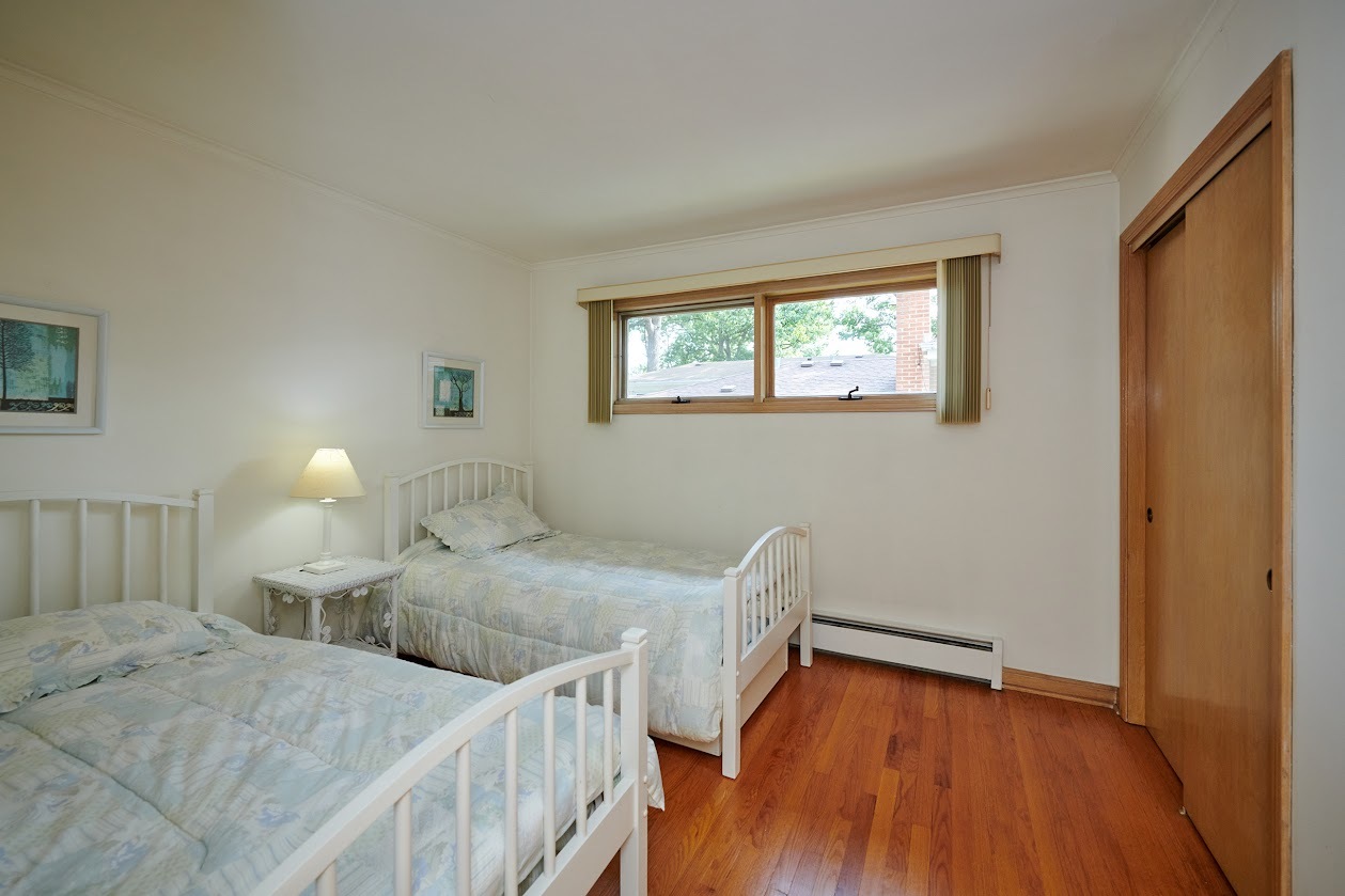 1859 Prairie Avenue Park Ridge, IL 60068 - Photo 15 of 27 a bedroom with two beds and a window