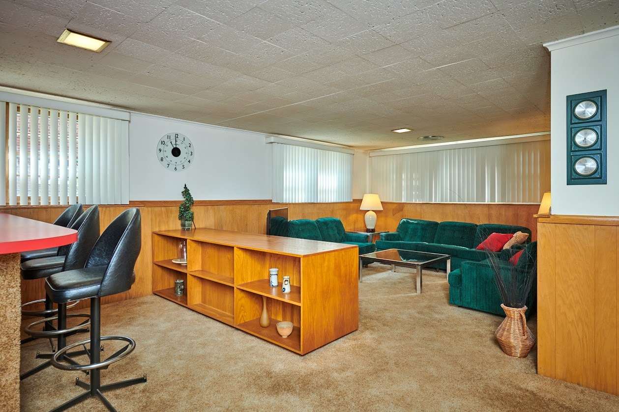 1859 Prairie Avenue Park Ridge, IL 60068 - Photo 17 of 27 a living room with furniture a flat screen tv and a dining table