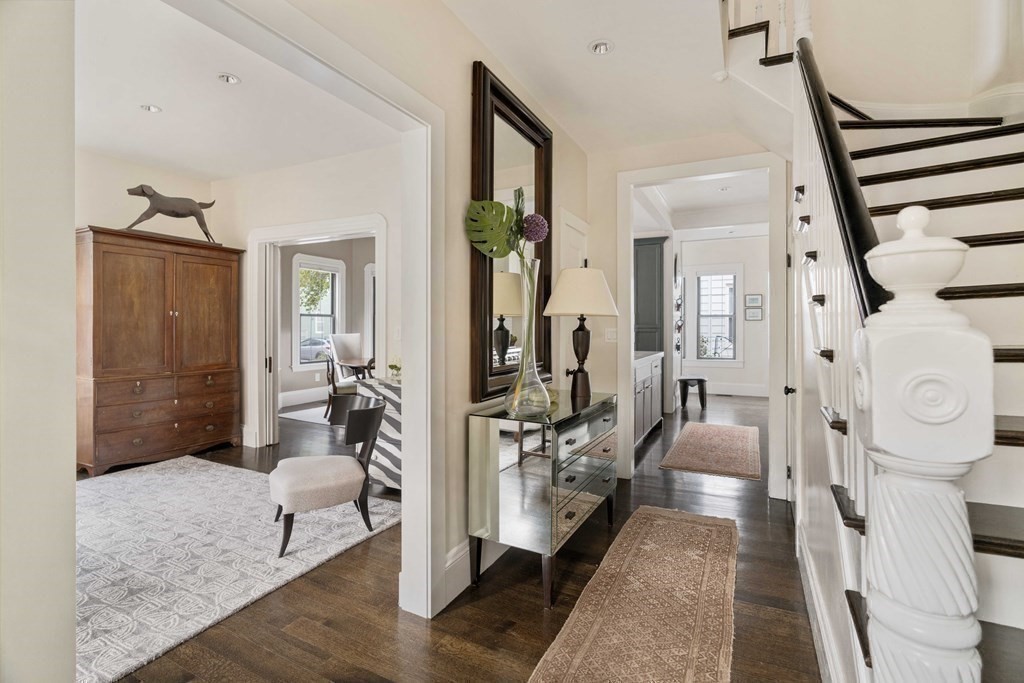 39 Meacham Road, Unit 39 Somerville, MA 02144 - Photo 2 of 40 a living room with furniture and a rug