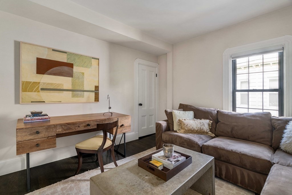 39 Meacham Road, Unit 39 Somerville, MA 02144 - Photo 26 of 40 a living room with furniture and a window