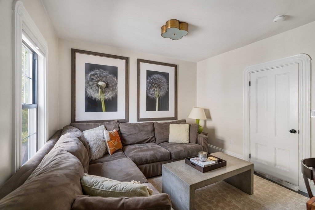 39 Meacham Road, Unit 39 Somerville, MA 02144 - Photo 27 of 40 a living room with furniture and a window