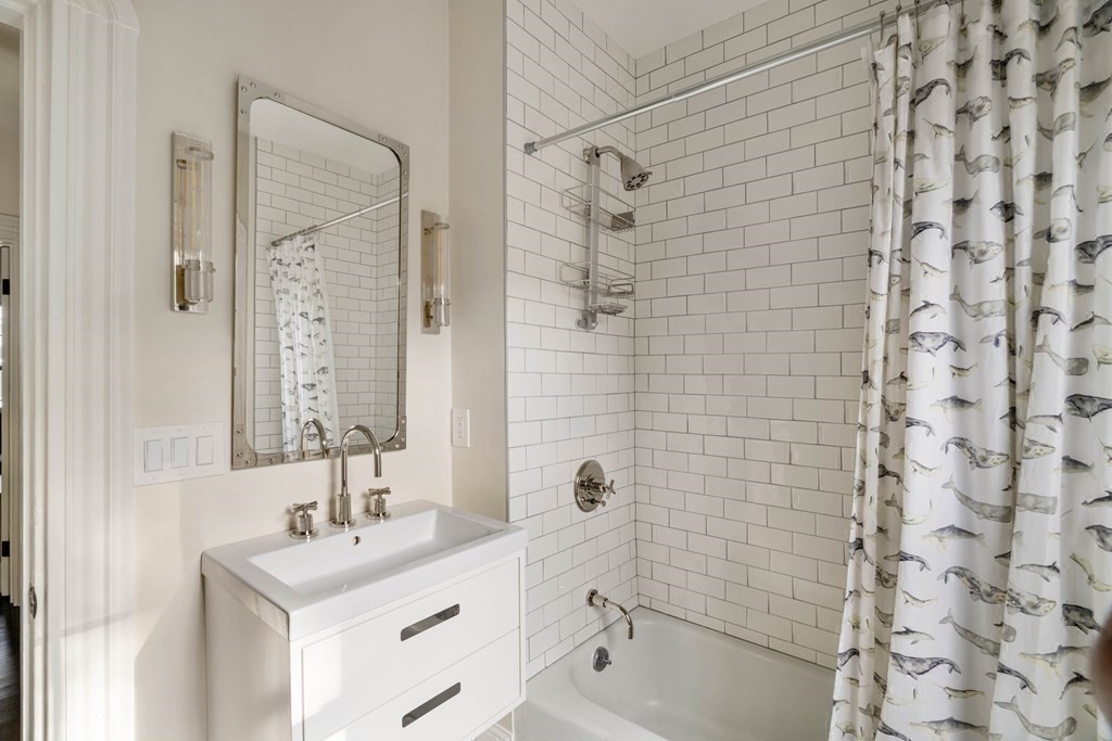 39 Meacham Road, Unit 39 Somerville, MA 02144 - Photo 29 of 40 a bathroom with a sink a toilet and shower