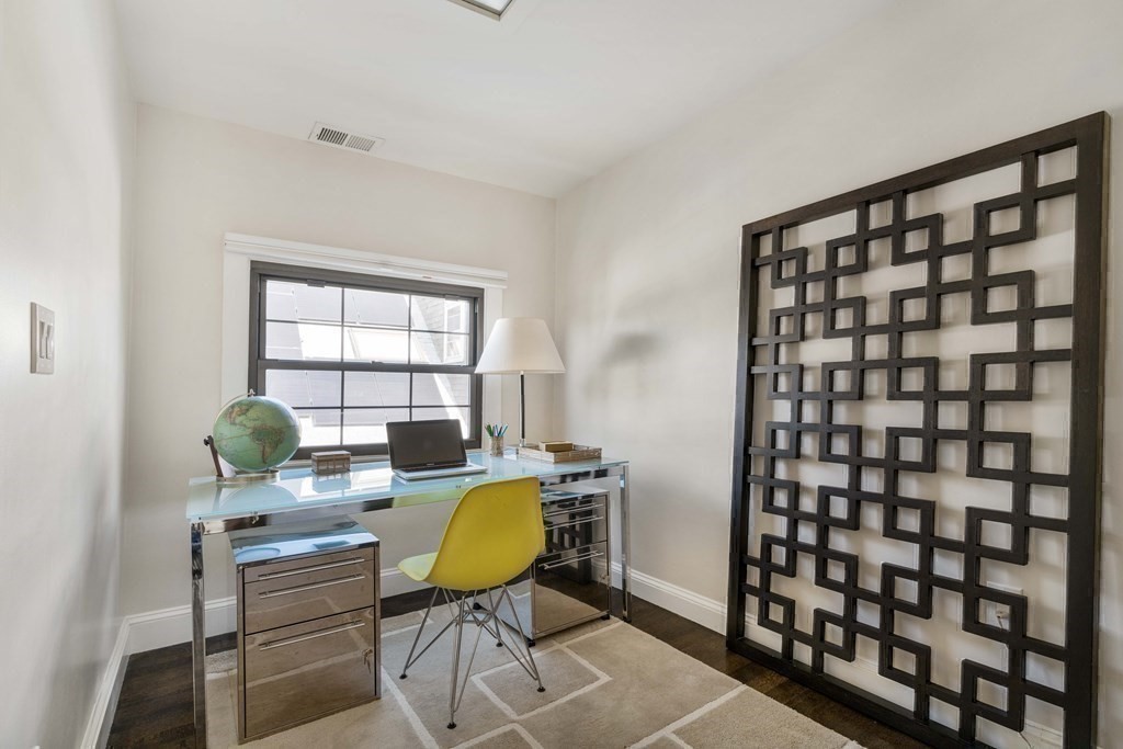 39 Meacham Road, Unit 39 Somerville, MA 02144 - Photo 33 of 40 a workspace room with furniture and a window