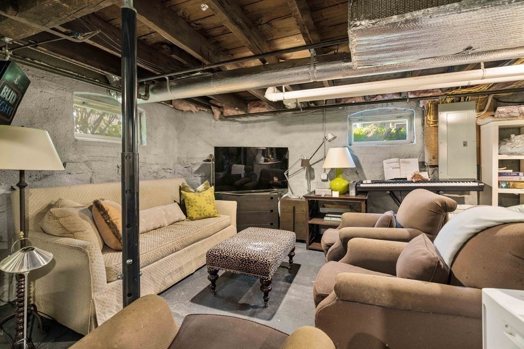 39 Meacham Road, Unit 39 Somerville, MA 02144 - Photo 34 of 40 a living room with furniture and a flat screen tv