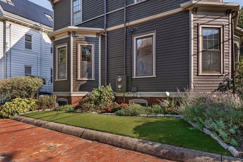 39 Meacham Road, Unit 39 Somerville, MA 02144 - Photo 38 of 40 a front view of a house with garden