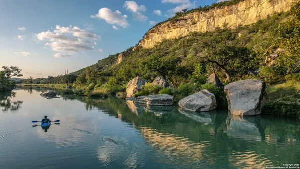a view of a lake with a building in the background