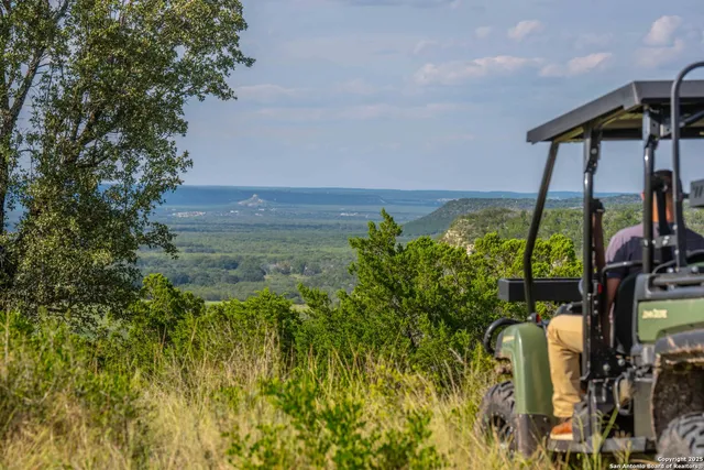 a kitchen with a refrigerator and a sink