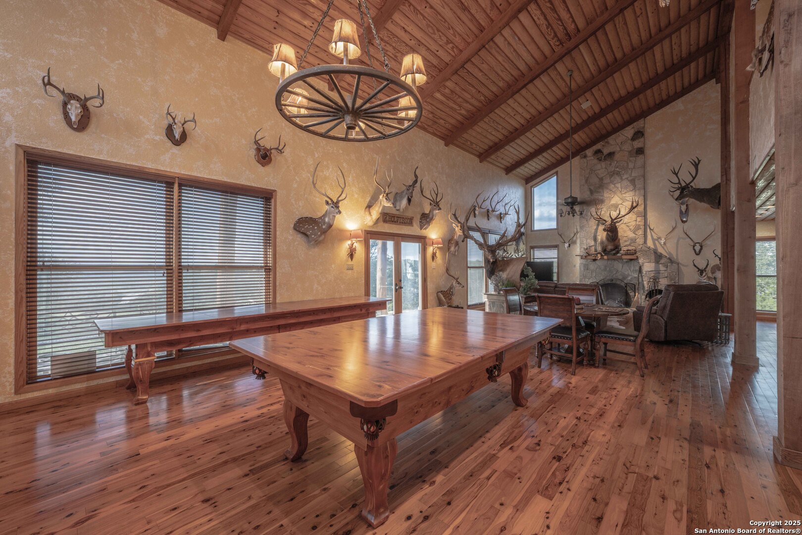 Tbd Fm 2169 Junction, TX 76849 - Photo 33 of 89 a dining room with wooden floor a chandelier a wooden table and chairs