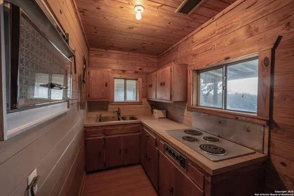 a view of a chairs in a backyard