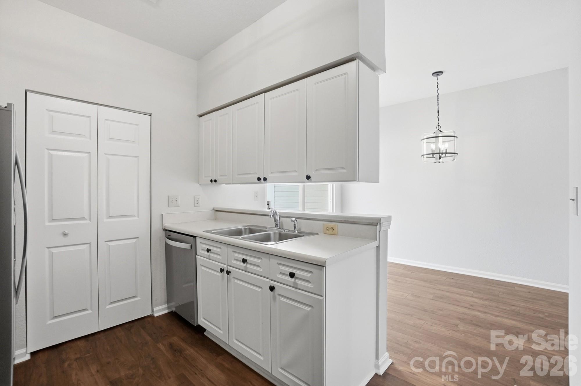 711 Stone Village Drive Fort Mill, SC 29708 - Photo 19 of 46 a kitchen with a sink cabinets and wooden floor