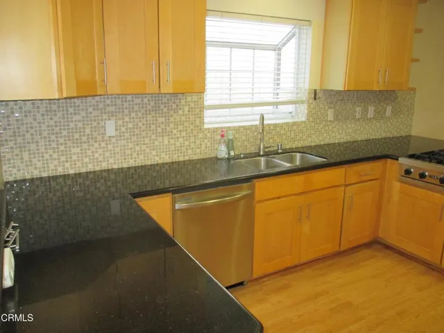 a view of a kitchen with a sink