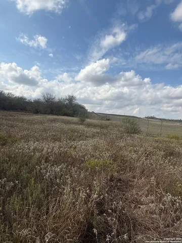 a view of a lake with houses in the back
