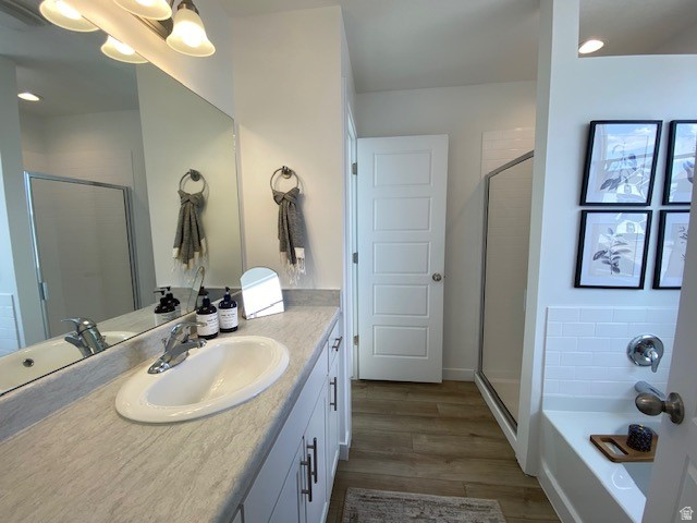 341 Quartz Road, Unit 8037 Tooele, UT 84074 - Photo 6 of 10 Bathroom featuring a vanity with an integrated sink, a large mirror, and overhead lighting